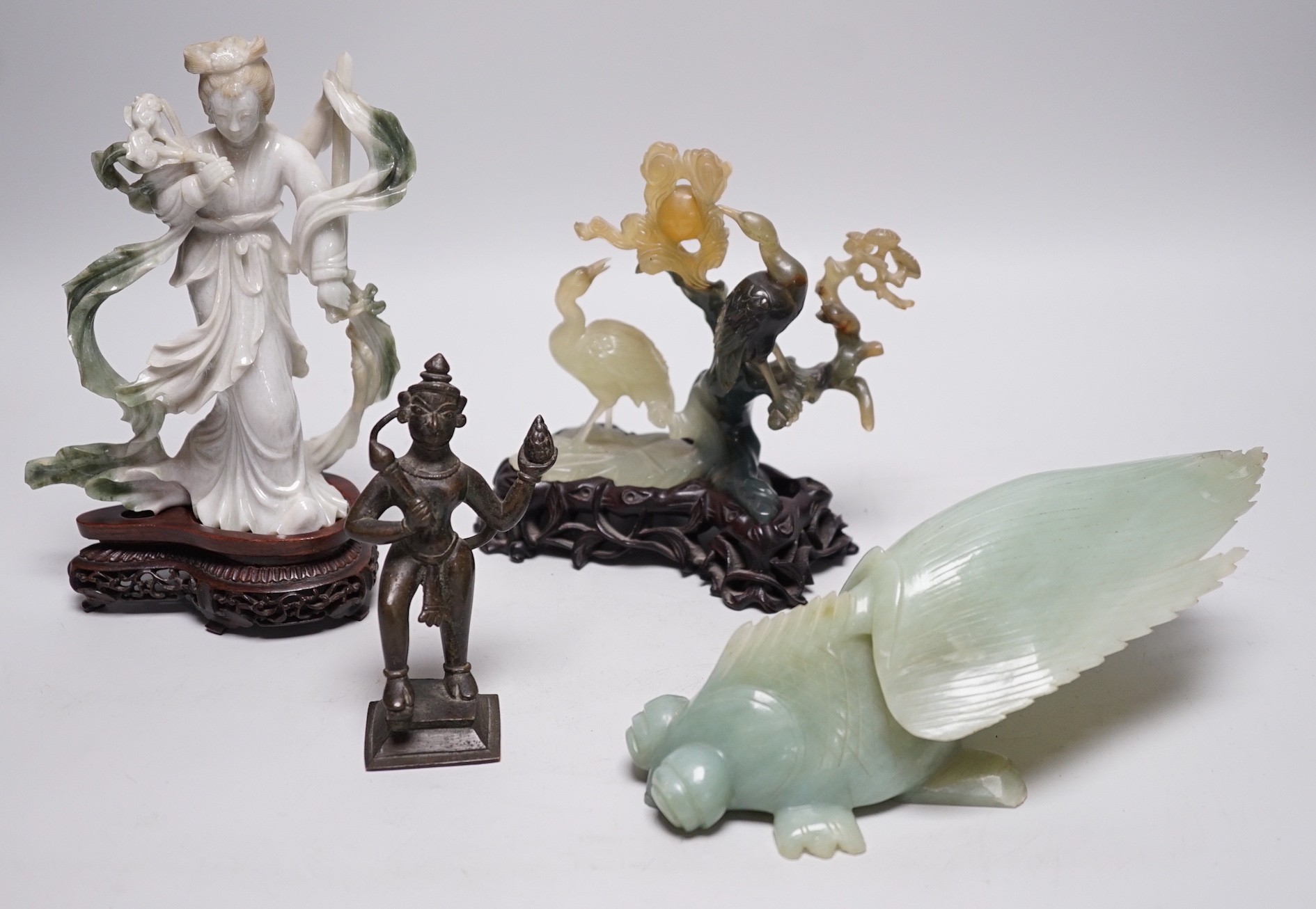 A Chinese bowenite jade bird group, together with a Jadeite figure of lady, 19.5cm high, a bowenite model of a goldfish, and an Indian brass figure